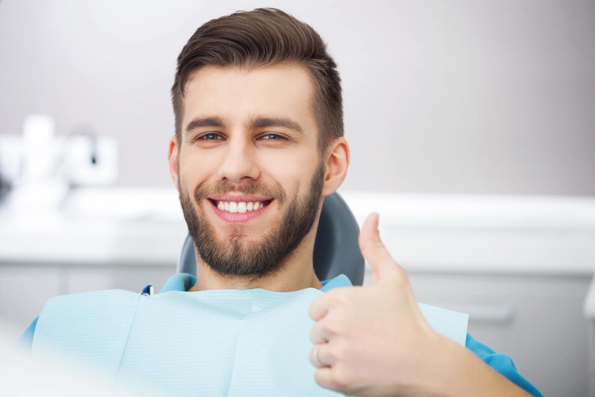 Patient receiving thoughtful care at Artistic Smiles